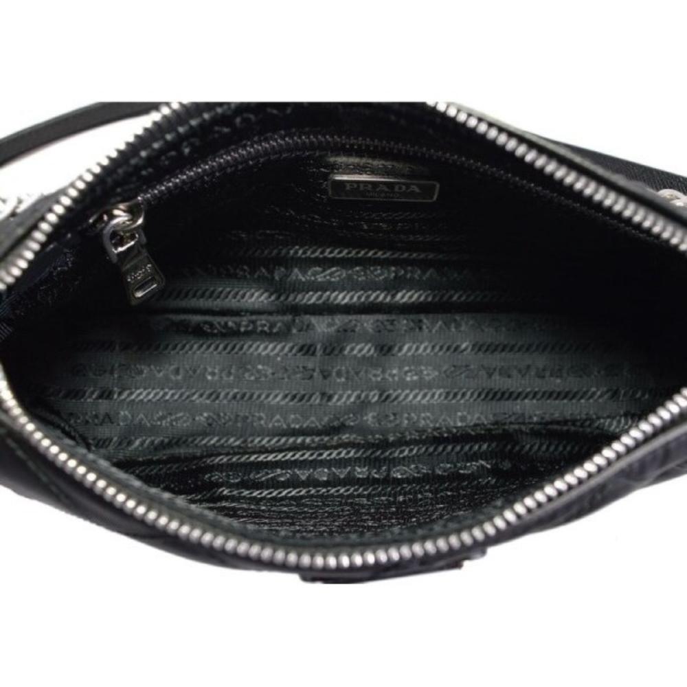 PRADA Bag 25 cm in black nylon and Saffiano calfskin to…